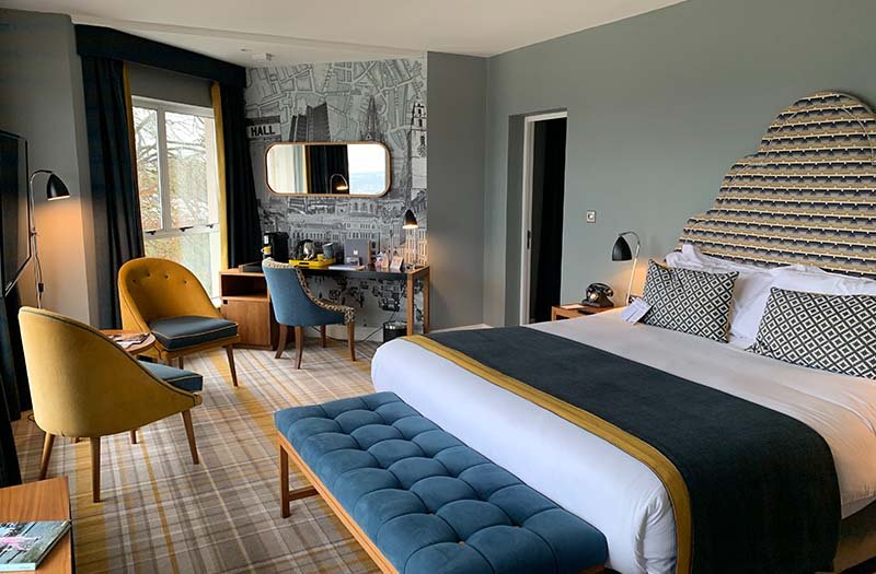 room with bed and chairs